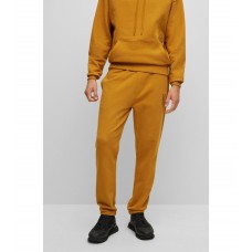 Hugo Boss Cuffed tracksuit bottoms in organic cotton with stacked logo 50482855-221 Orange